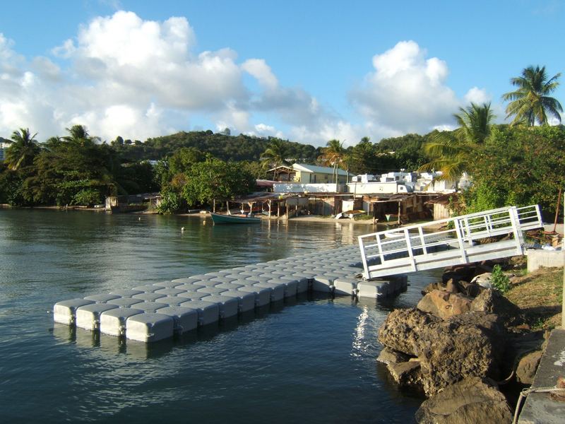 Floating jetty with gangway on a tropical coastline